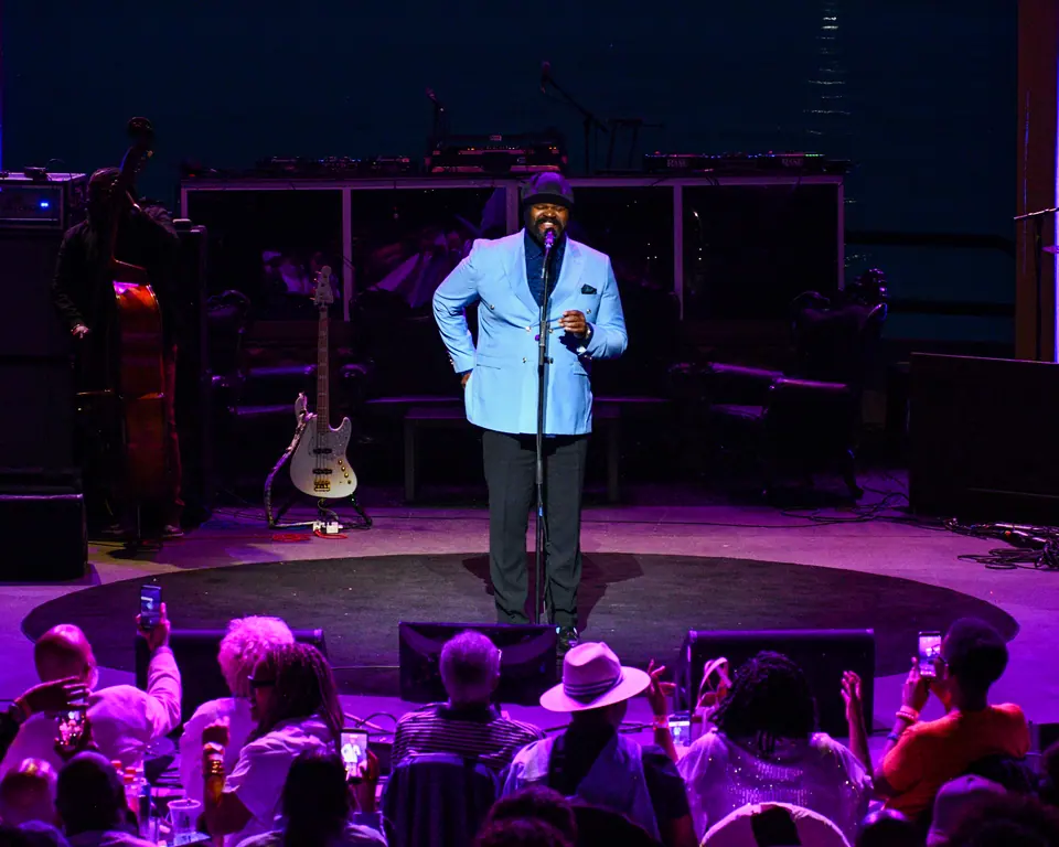 Gregory Porter performs for a riverfront crowd at dusk